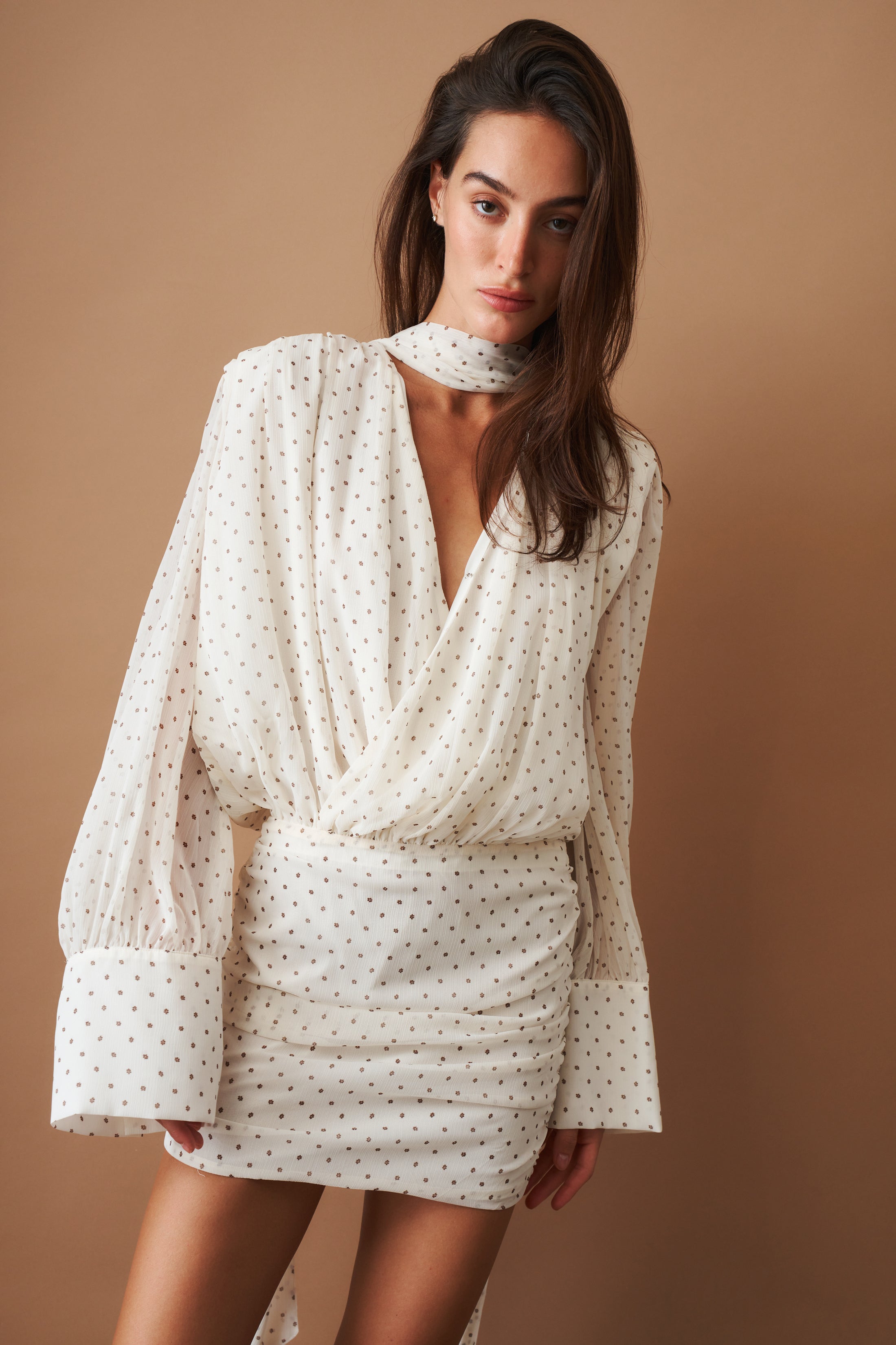 Elegant chiffon long sleeve V-neck dress by ROTATE, featuring a flowing design and subtle detailing for a sophisticated look.