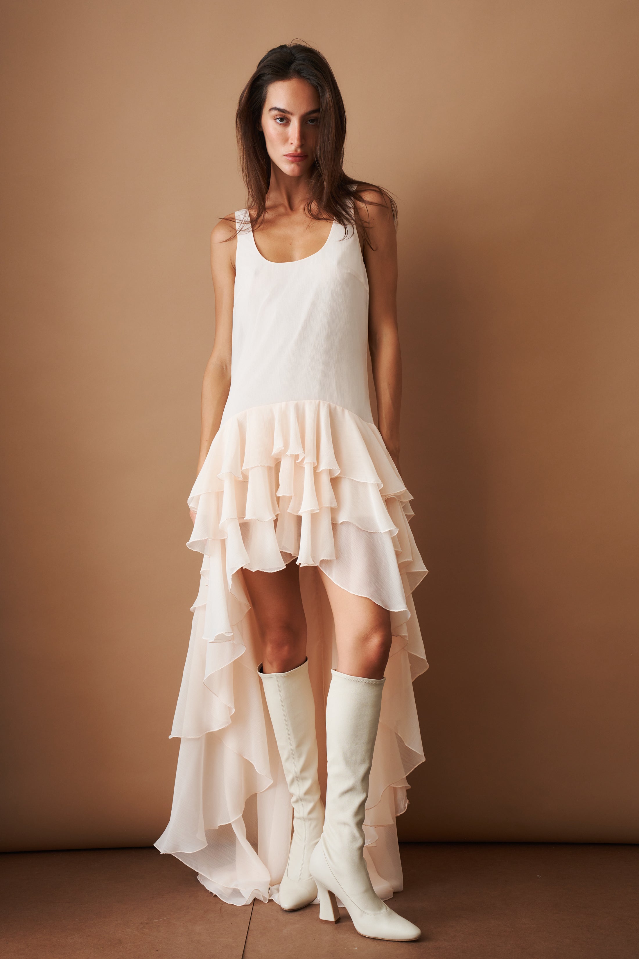 Light blue chiffon ruffle dress by ROTATE, flowing fabric with layered ruffles, perfect for summer or special occasions.