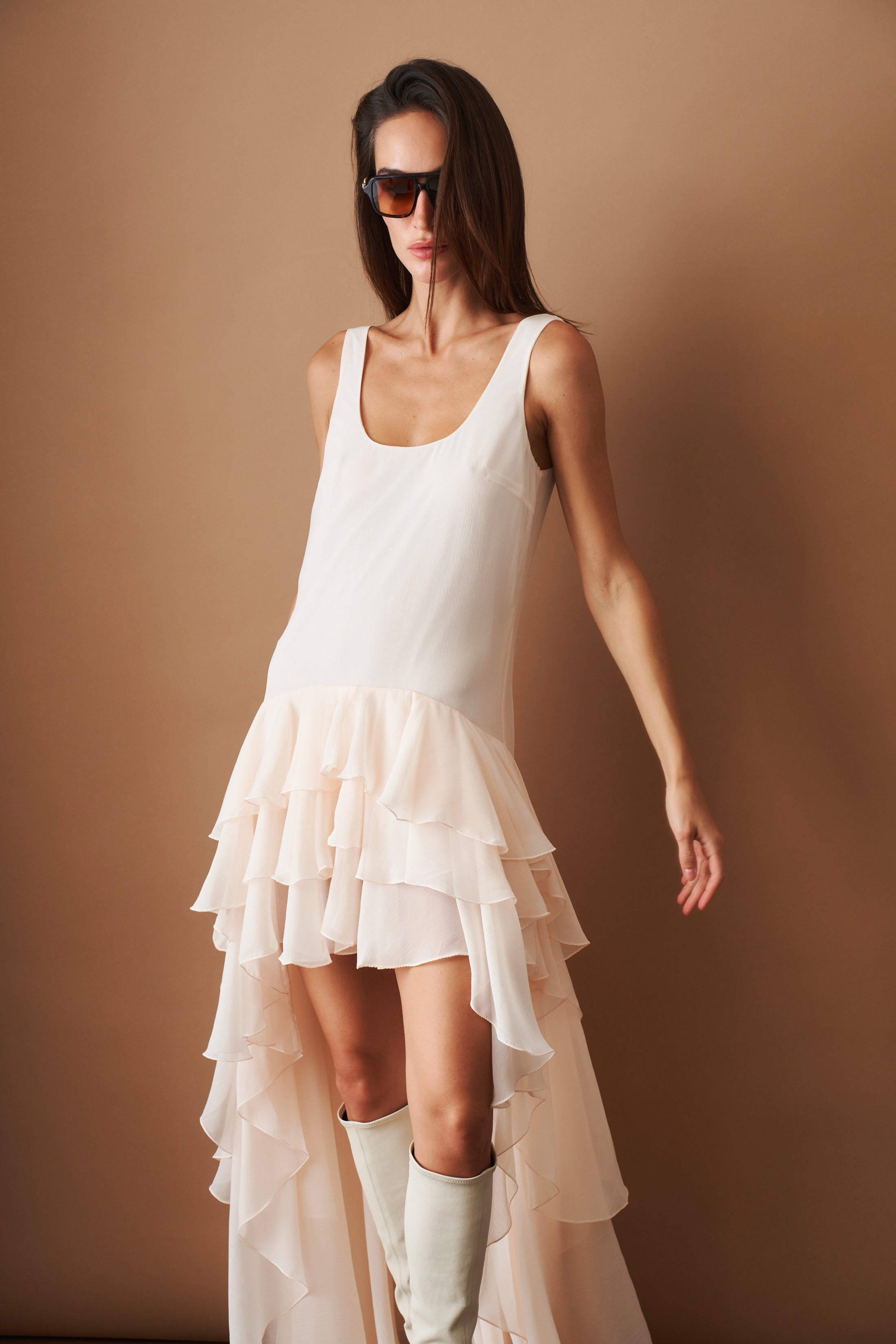 Light pink ROTATE chiffon ruffle dress with flowing fabric and elegant design, suitable for summer or special occasions.