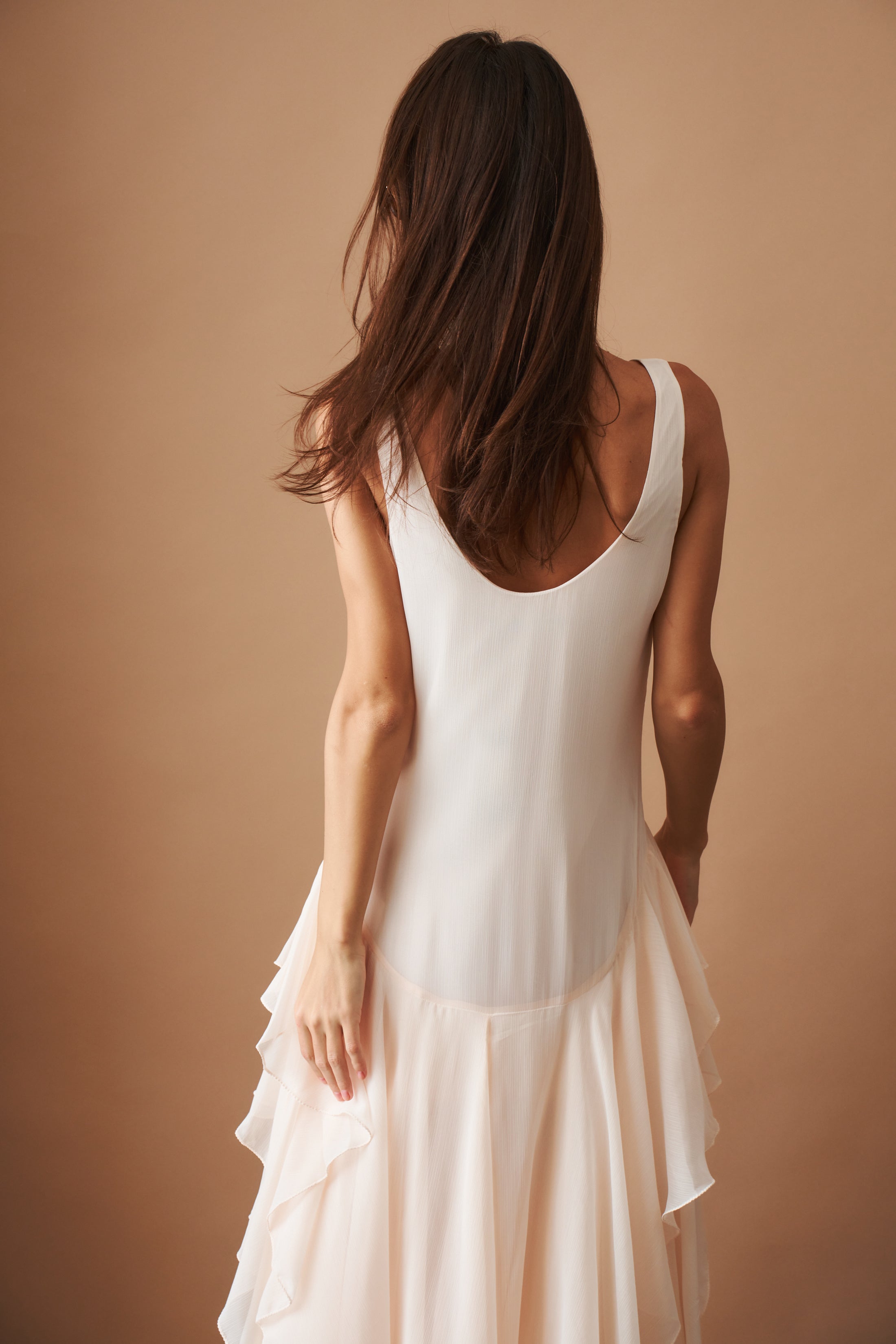 Light blue chiffon ruffle dress by ROTATE, featuring flowing fabric and elegant ruffle details, perfect for summer occasions.