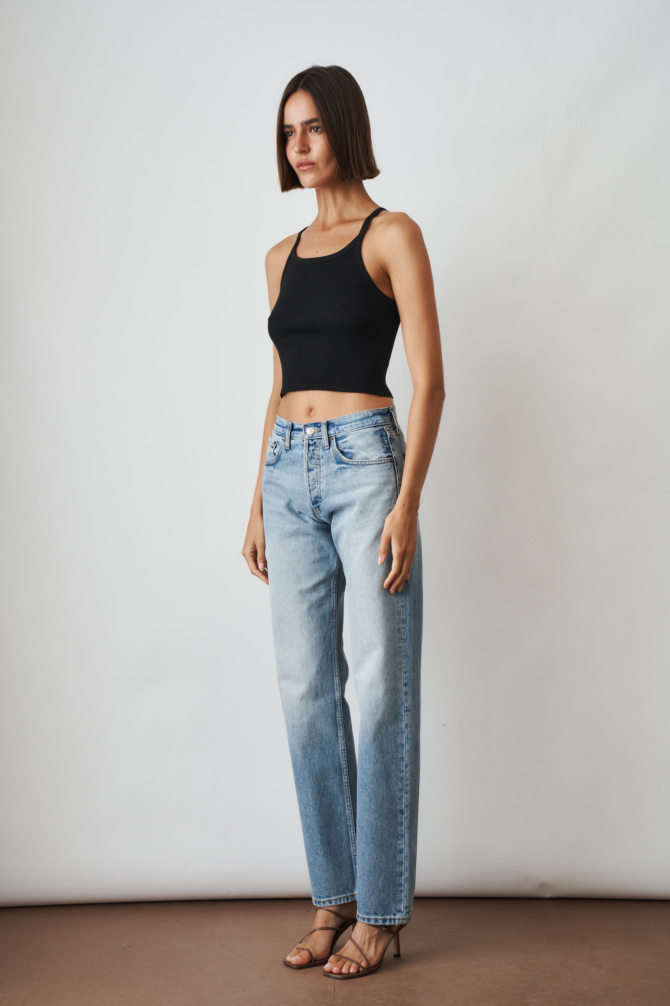 A pair of AYA MUSE straight jeans in XXS, featuring classic denim fabric and a fitted silhouette on a plain background.