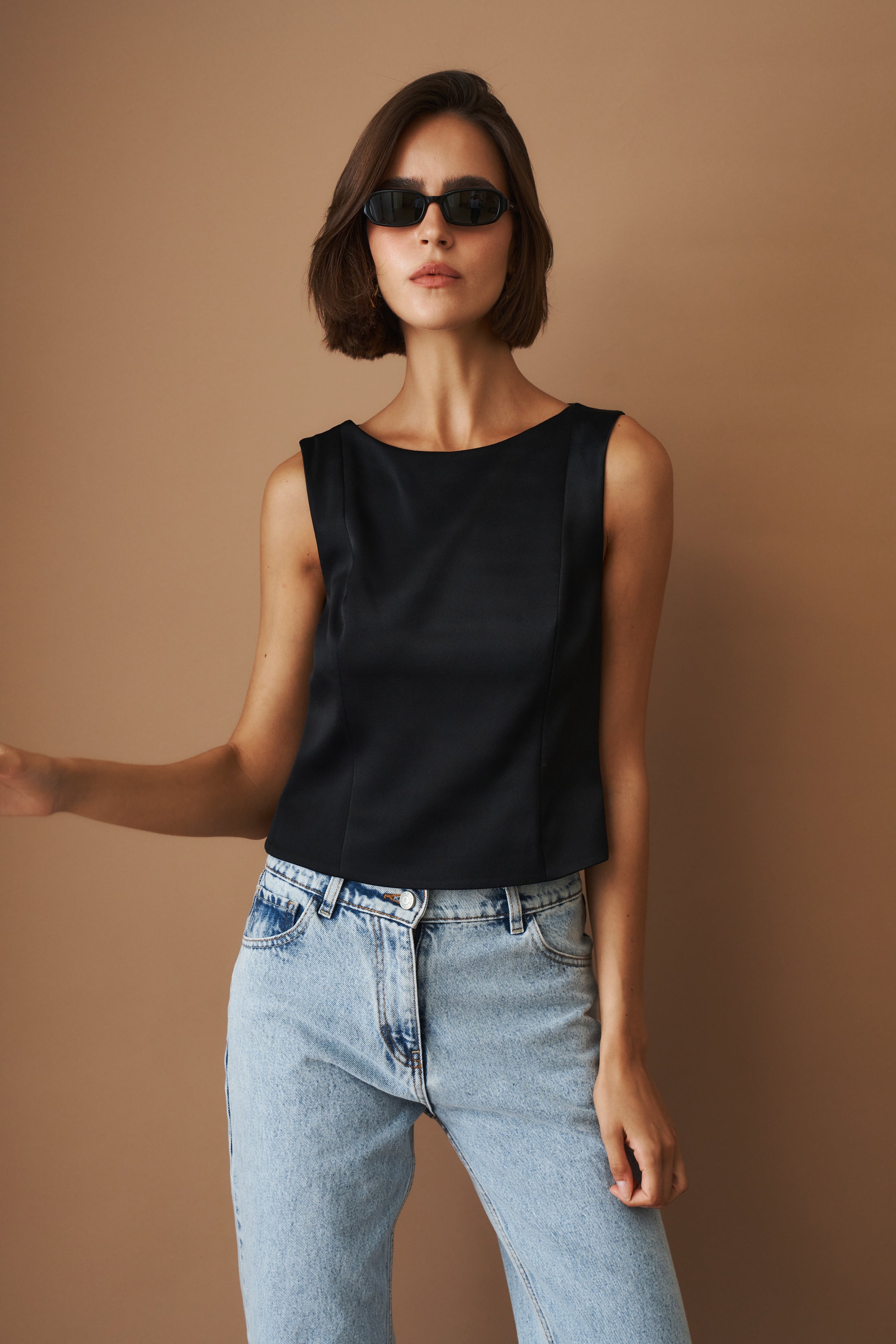 DÉSORDRE Hargrave Top in soft fabric, featuring a relaxed fit with a round neckline and long sleeves, stylishly displayed.