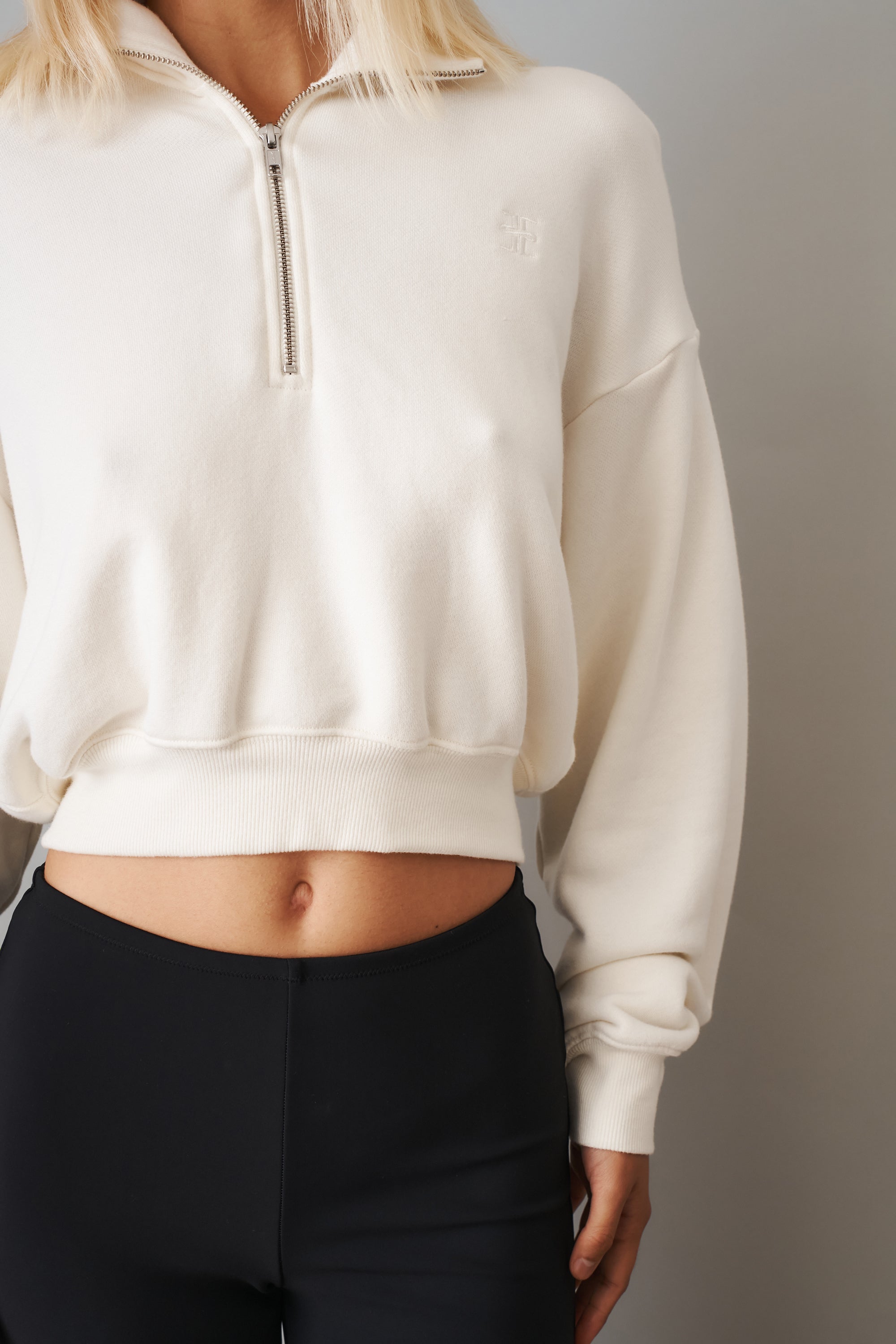 Cream cropped half zip sweatshirt from ETERNE, featuring a stylish fit and ribbed cuffs, perfect for casual wear.