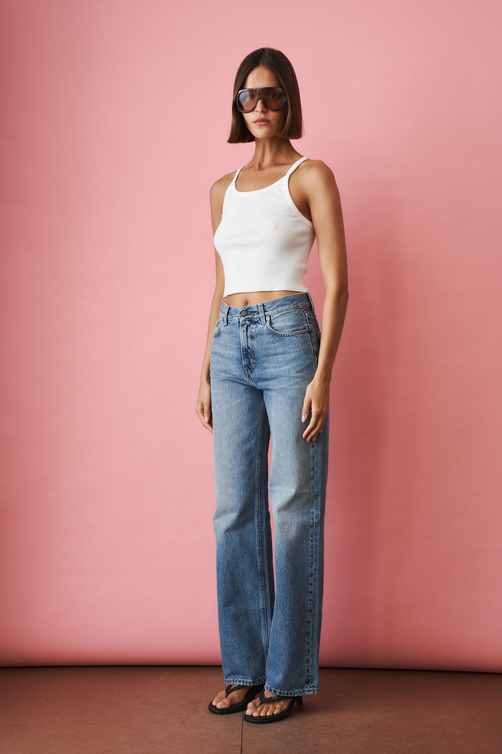 Haikure Korea Nordic Blue jeans showing a slim fit design with classic denim texture and subtle fading.