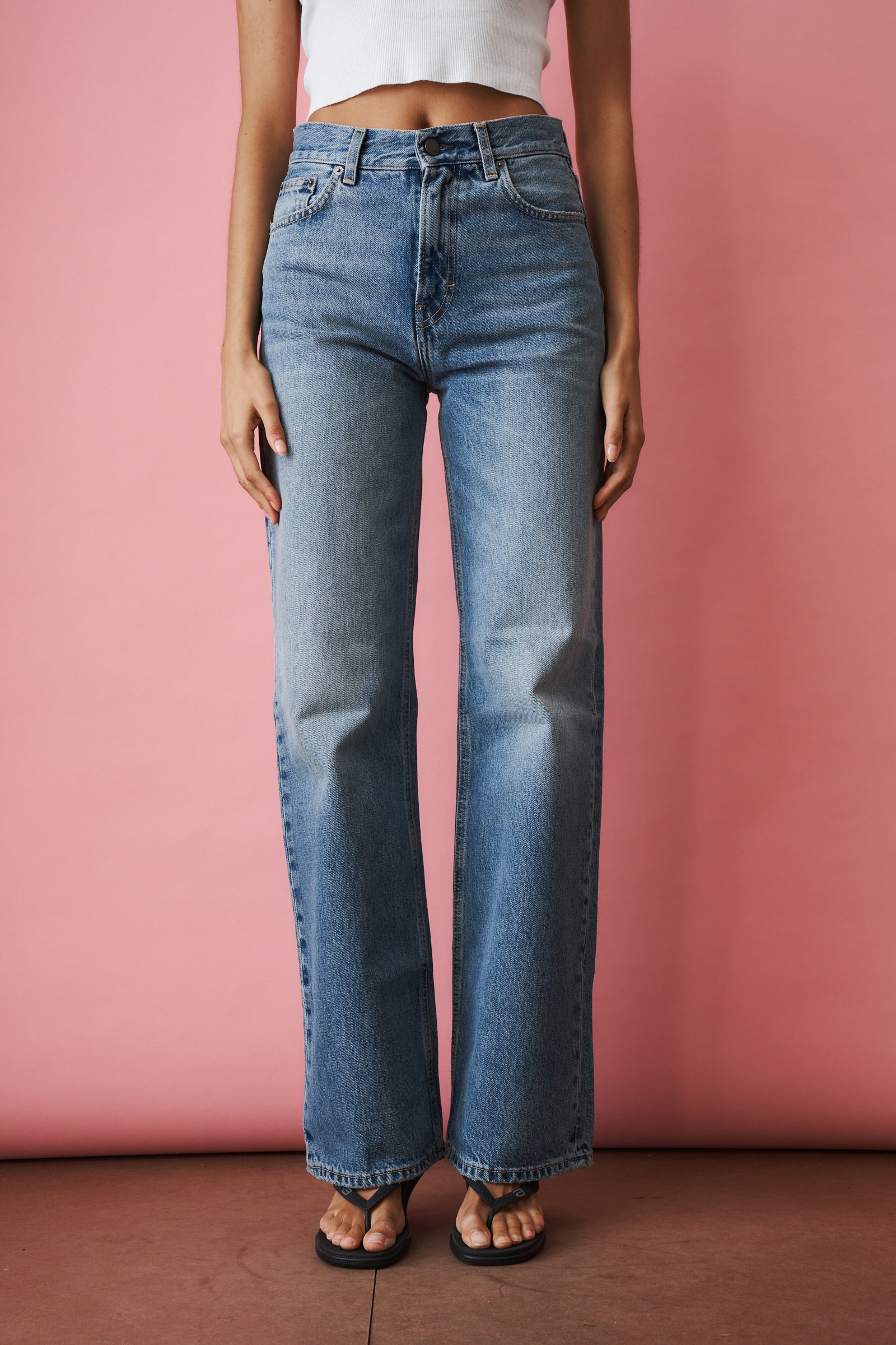 Haikure Korea Nordic Blue jeans, slim-fit denim pants with classic five-pocket design and subtle fading detail.