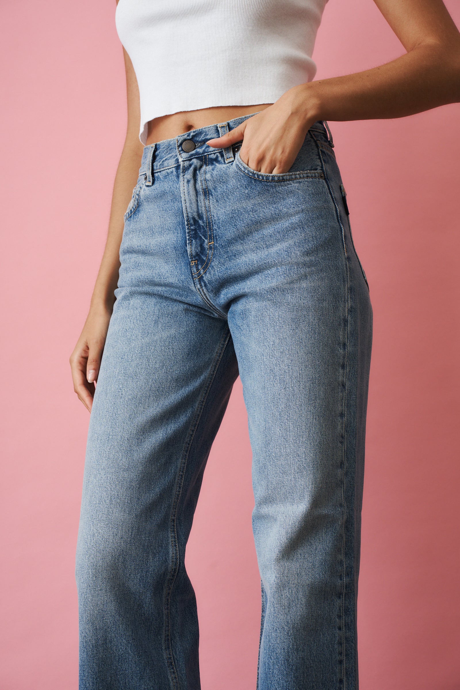Haikure Korea Nordic Blue jeans showing slim fit design, denim fabric, and classic five-pocket style on a plain background.