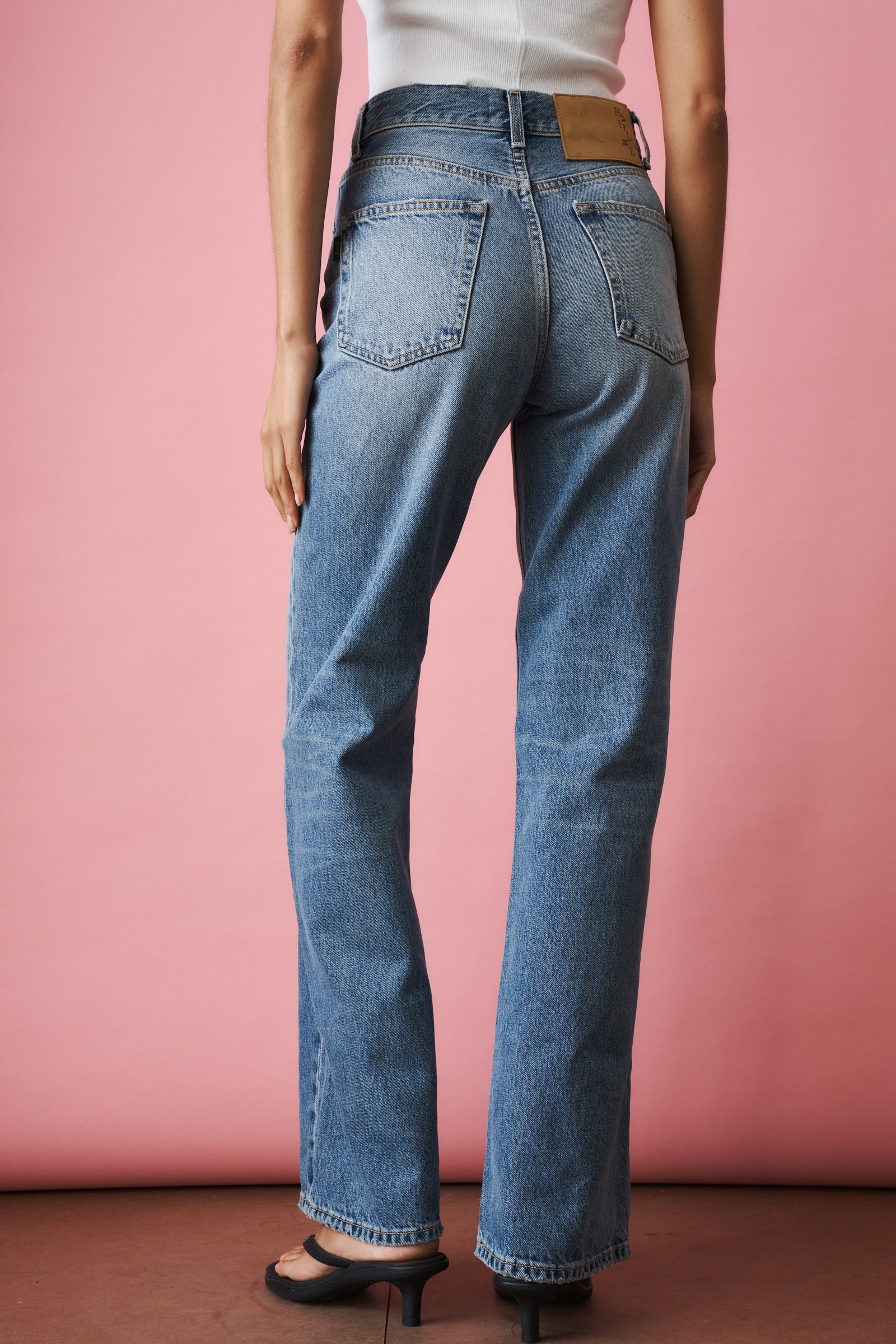 Haikure Korea Nordic Blue jeans displayed on a model, showcasing slim fit design and classic denim style.