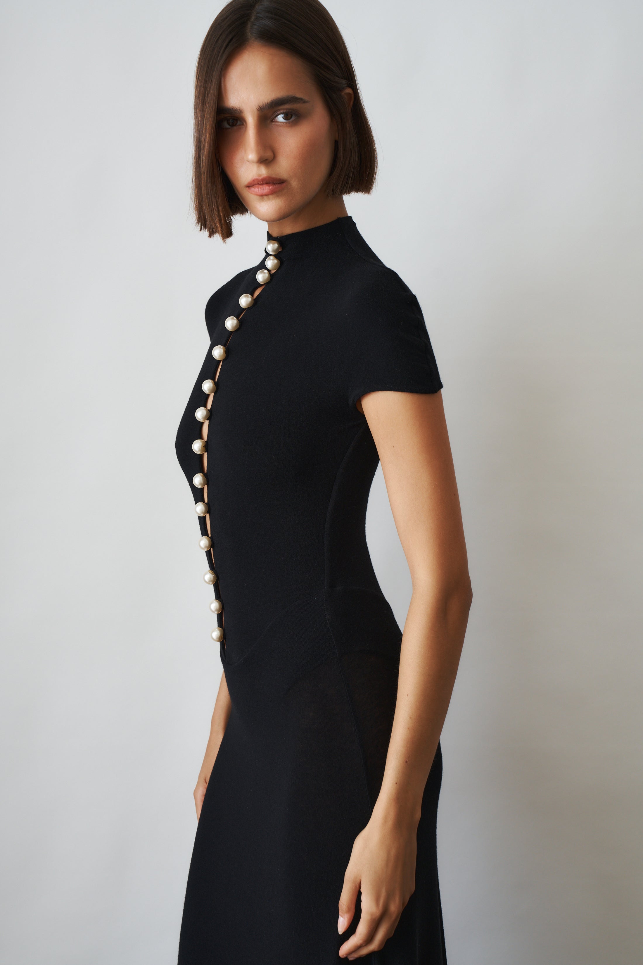 Black Mia Dress by MANURI, stylish sleeveless dress with a fitted silhouette, perfect for casual or semi-formal occasions.