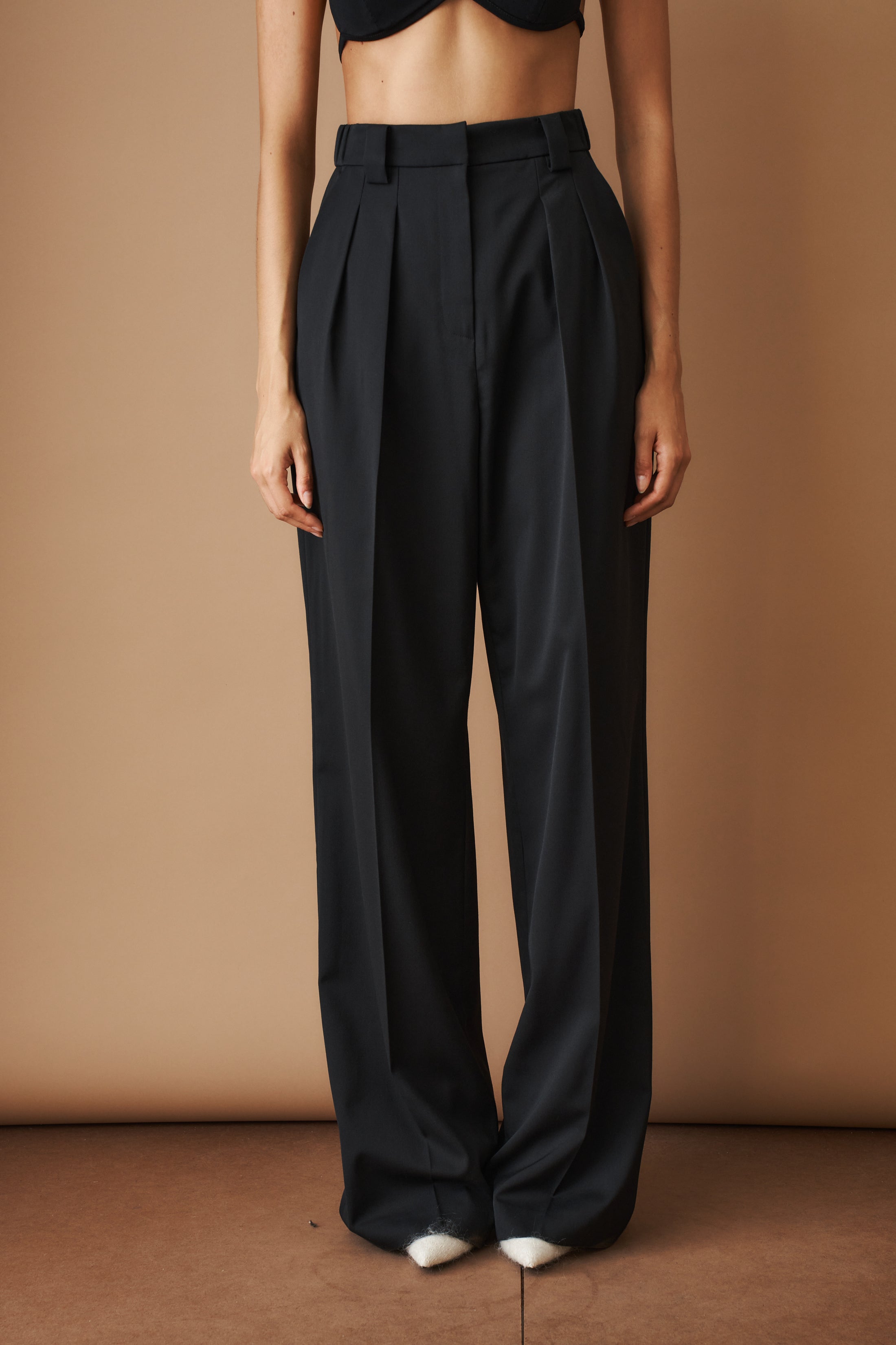 Black wool pants from MOMS PANTS, featuring a tailored fit and classic style, displayed on a neutral background.