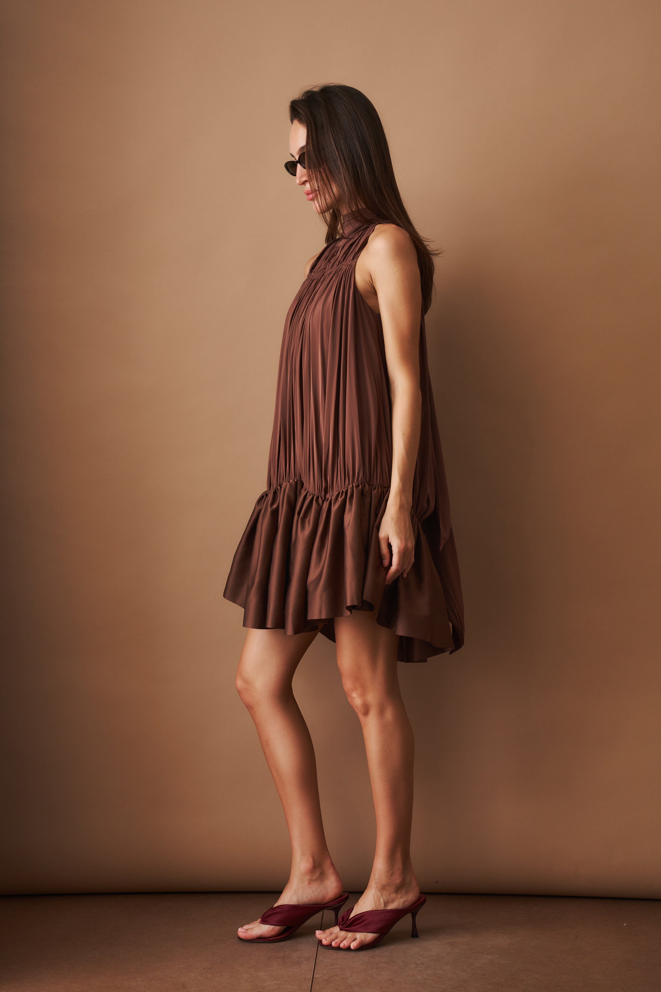 Rotate Gathered Mini Dress, stylish sleeveless dress with a fitted waist and gathered fabric, perfect for casual or semi-formal wear.