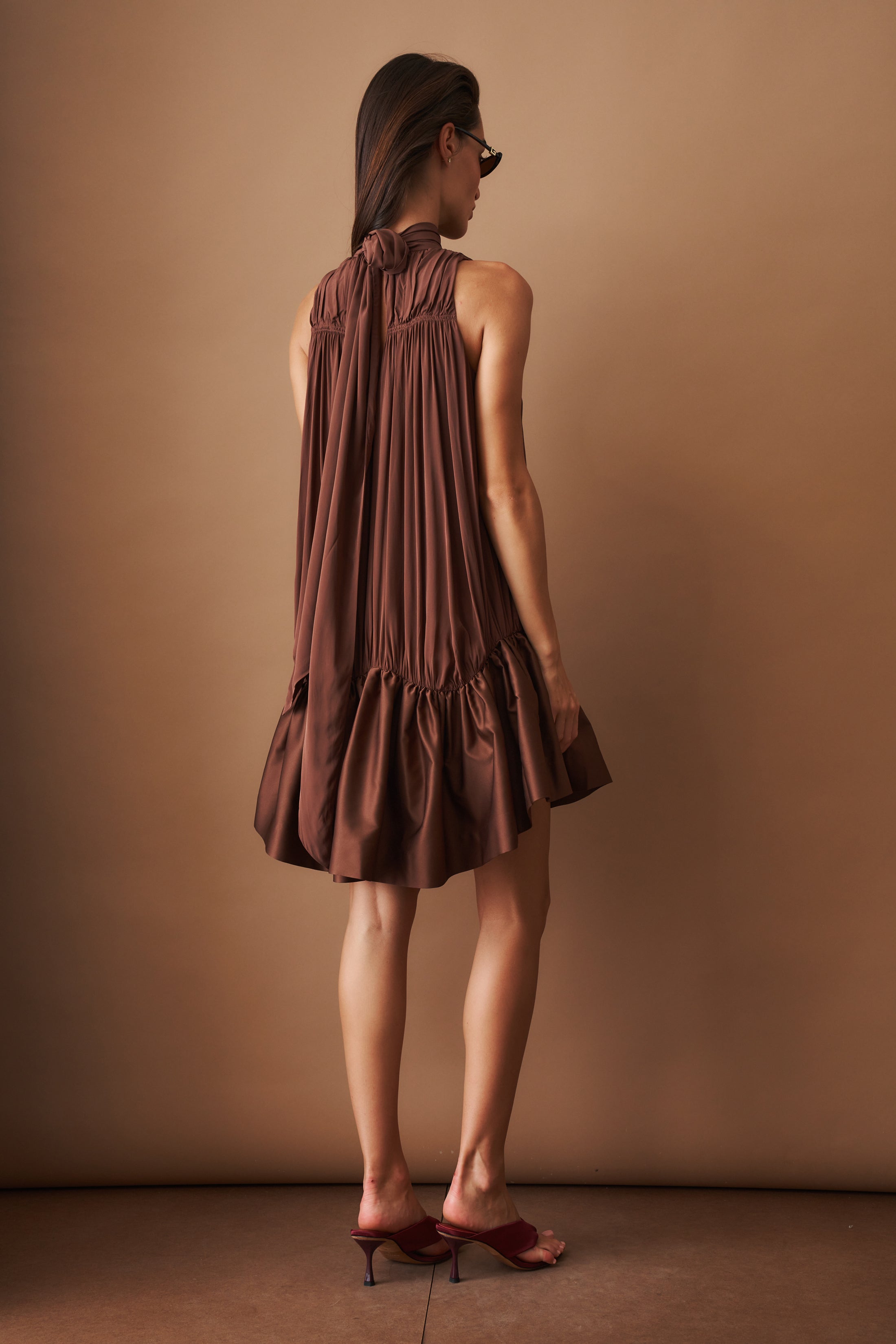 Rotate Gathered Mini Dress, stylish sleeveless dress with a fitted bodice and gathered fabric, perfect for casual or semi-formal wear.