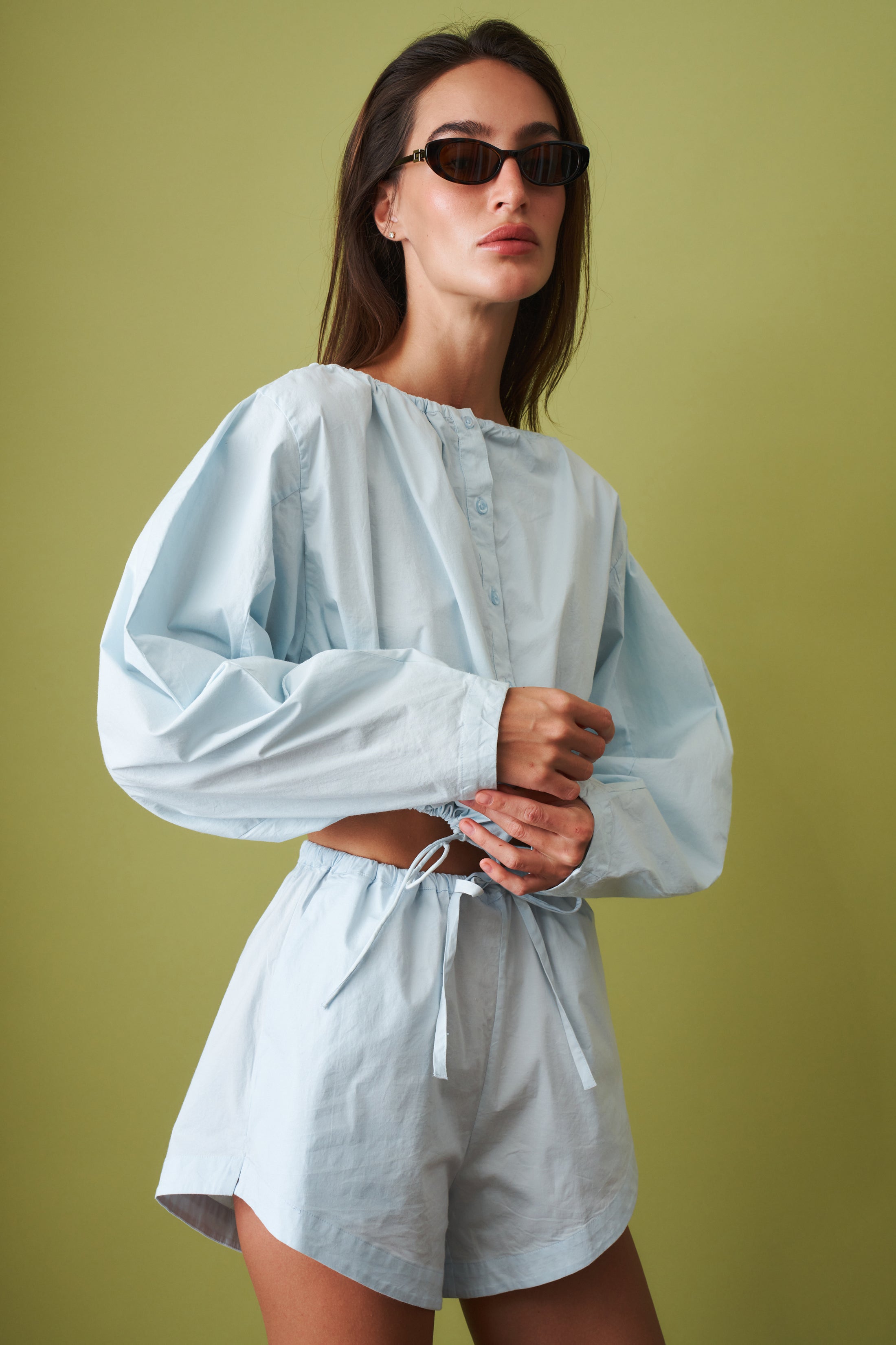 Rotate Desordre tie strap long sleeve top with fitted silhouette and casual style, shown in a stylish, neutral fabric.