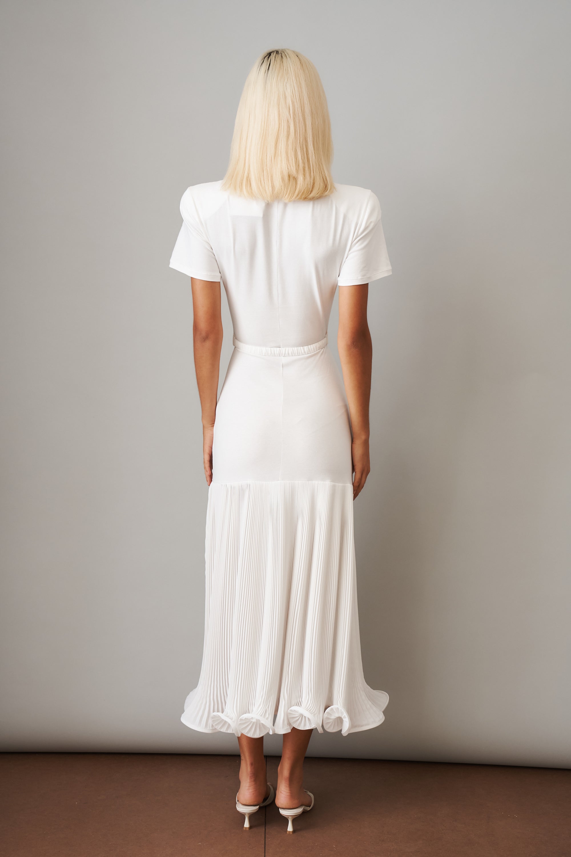 Polo Dress with Pleated Skirt in White - DÉSORDRE