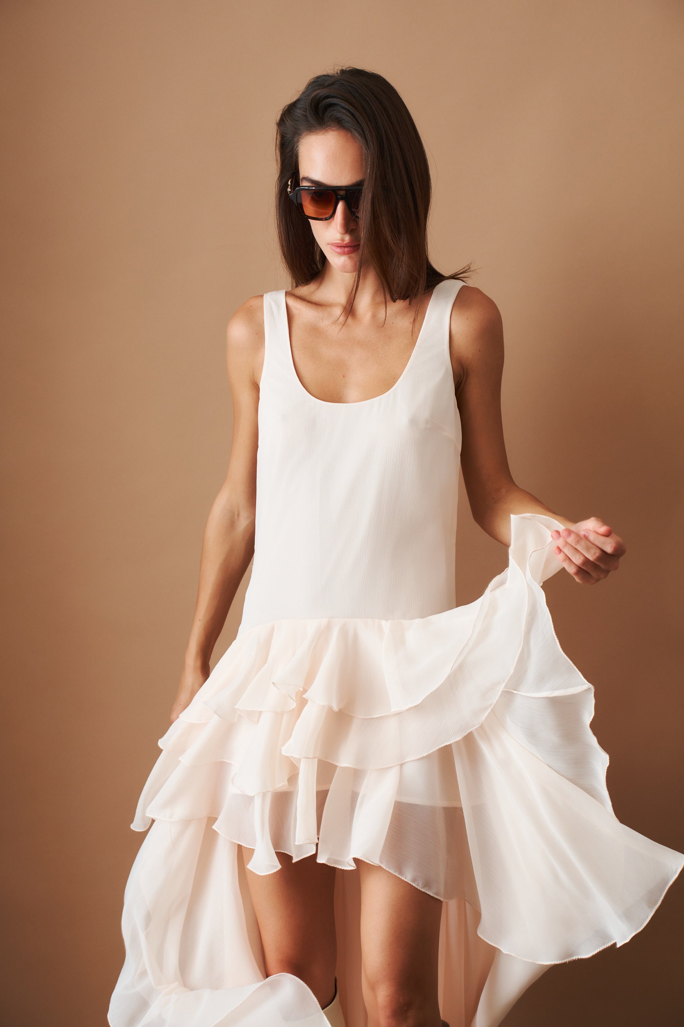 Rotate chiffon ruffle dress showing flowing fabric and ruffle details, perfect for elegant summer occasions.