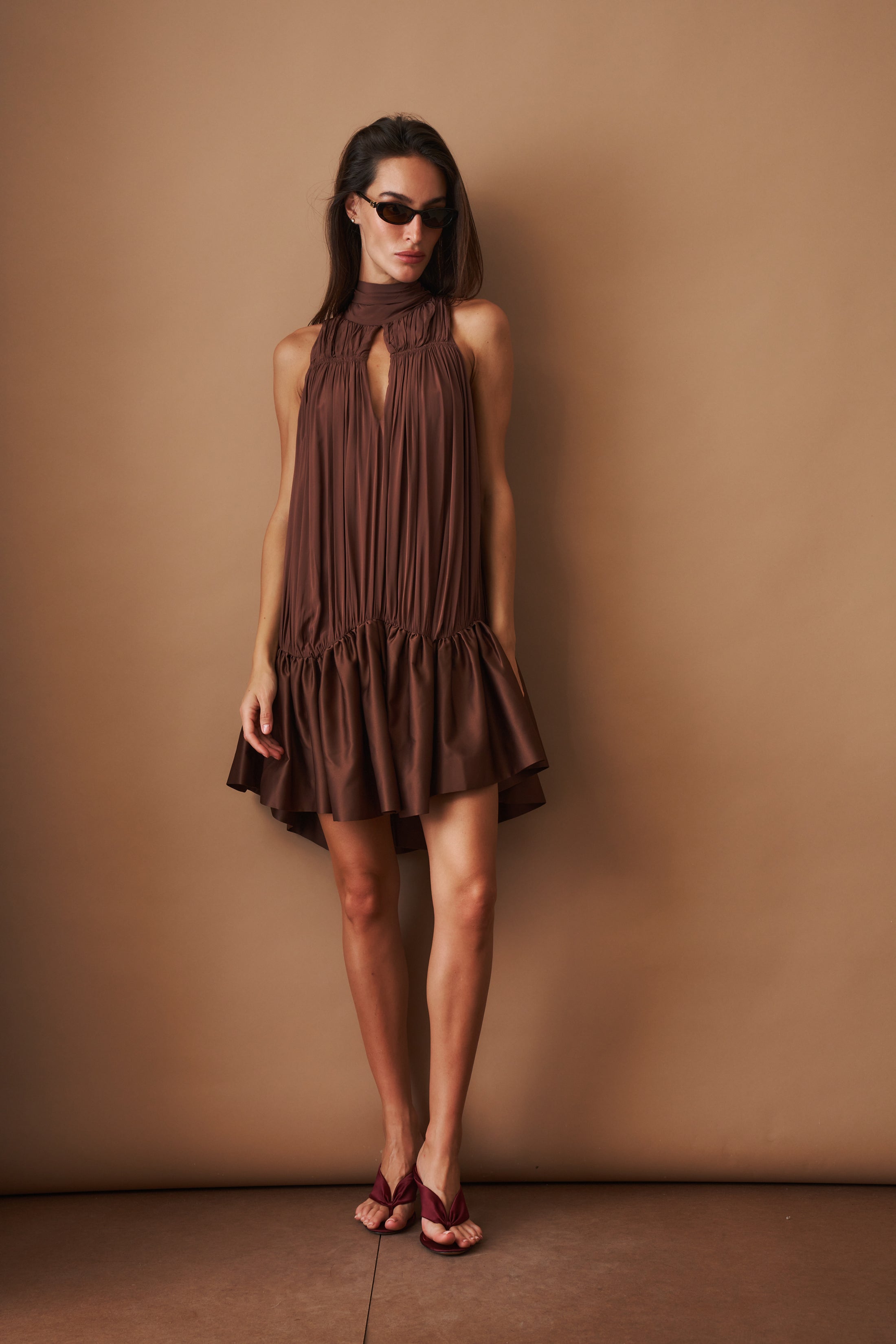 Rotate Gathered Mini Dress, stylish sleeveless dress with a gathered waist, in a vibrant fabric, perfect for casual and summer wear.