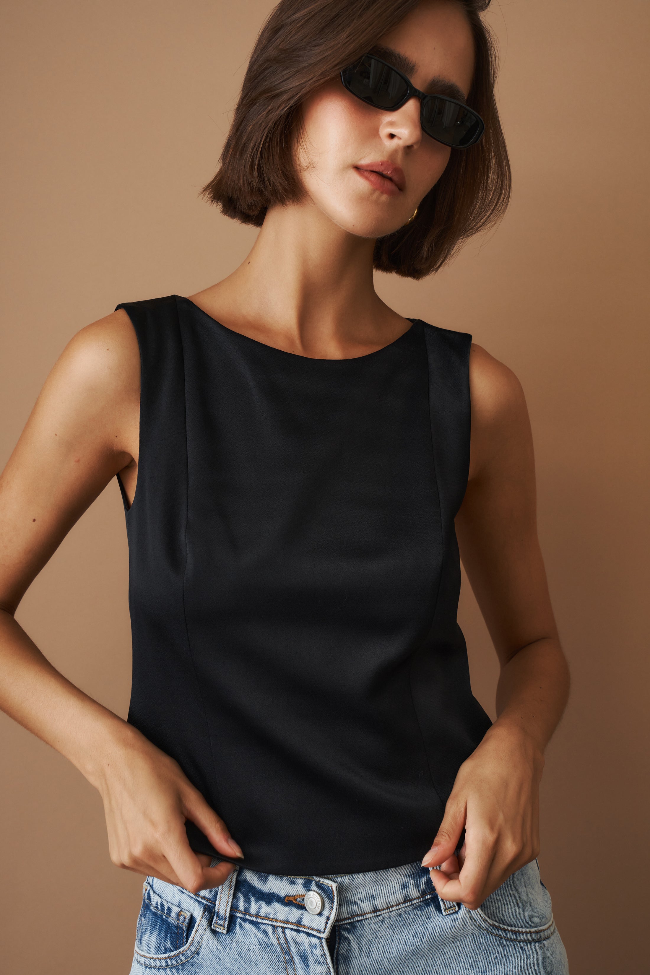 DÉSORDRE Hargrave Top, stylish women's blouse with long sleeves and button details, in a neutral fabric.