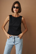 DÉSORDRE Hargrave Top shown in soft fabric with a relaxed fit, featuring a round neckline and long sleeves.