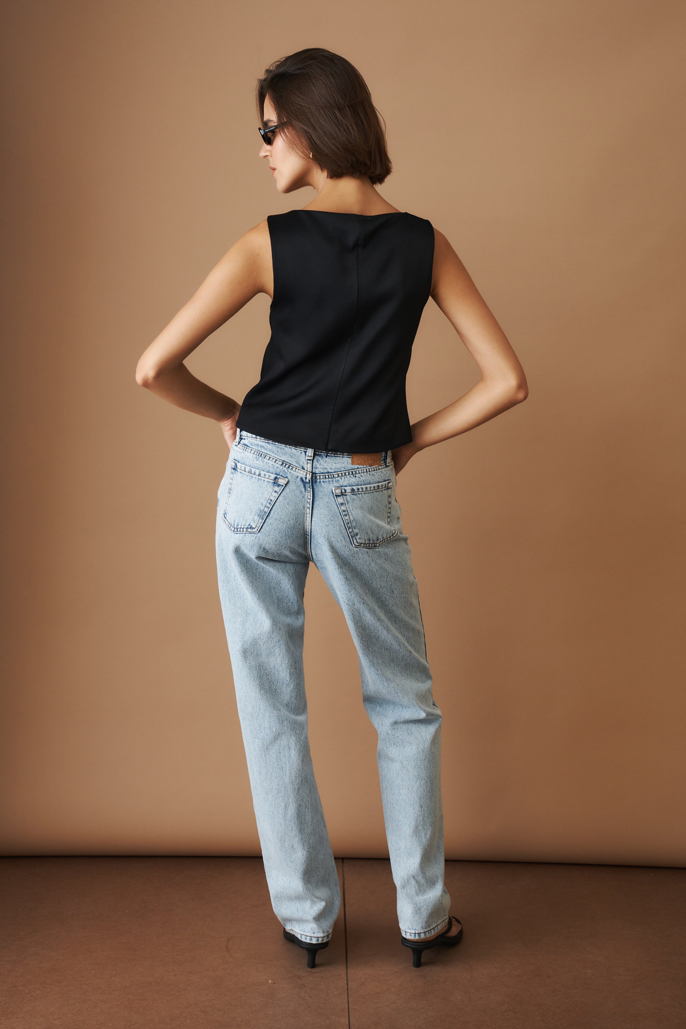 DÉSORDRE Hargrave top in soft fabric with a relaxed fit, featuring a round neckline and long sleeves, styled on a model.