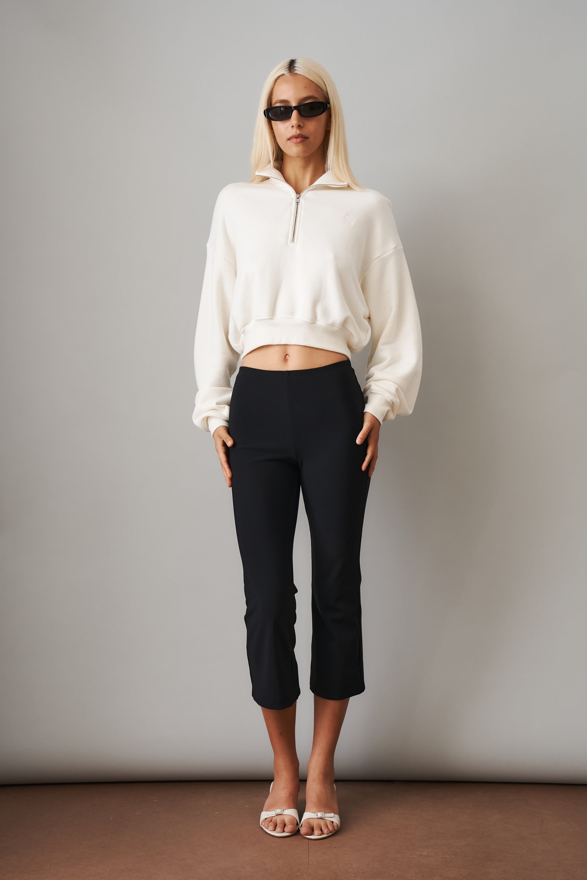 Cream cropped half-zip sweatshirt from ETERNE, featuring a relaxed fit, soft fabric, and stylish collar detail.