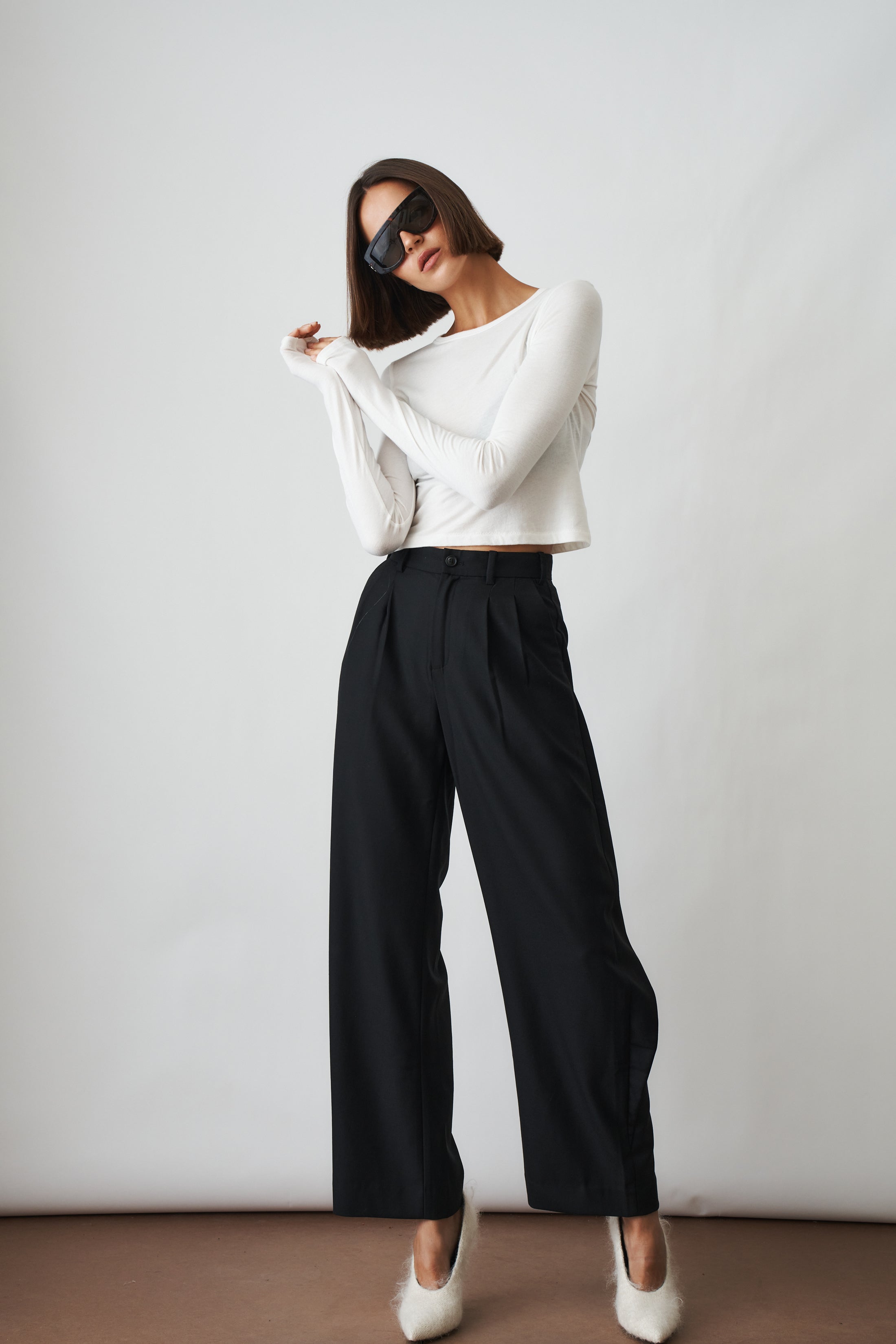 Ivory long sleeve baby tee from ETERNE, soft cotton tops for infants with a simple, comfortable design.