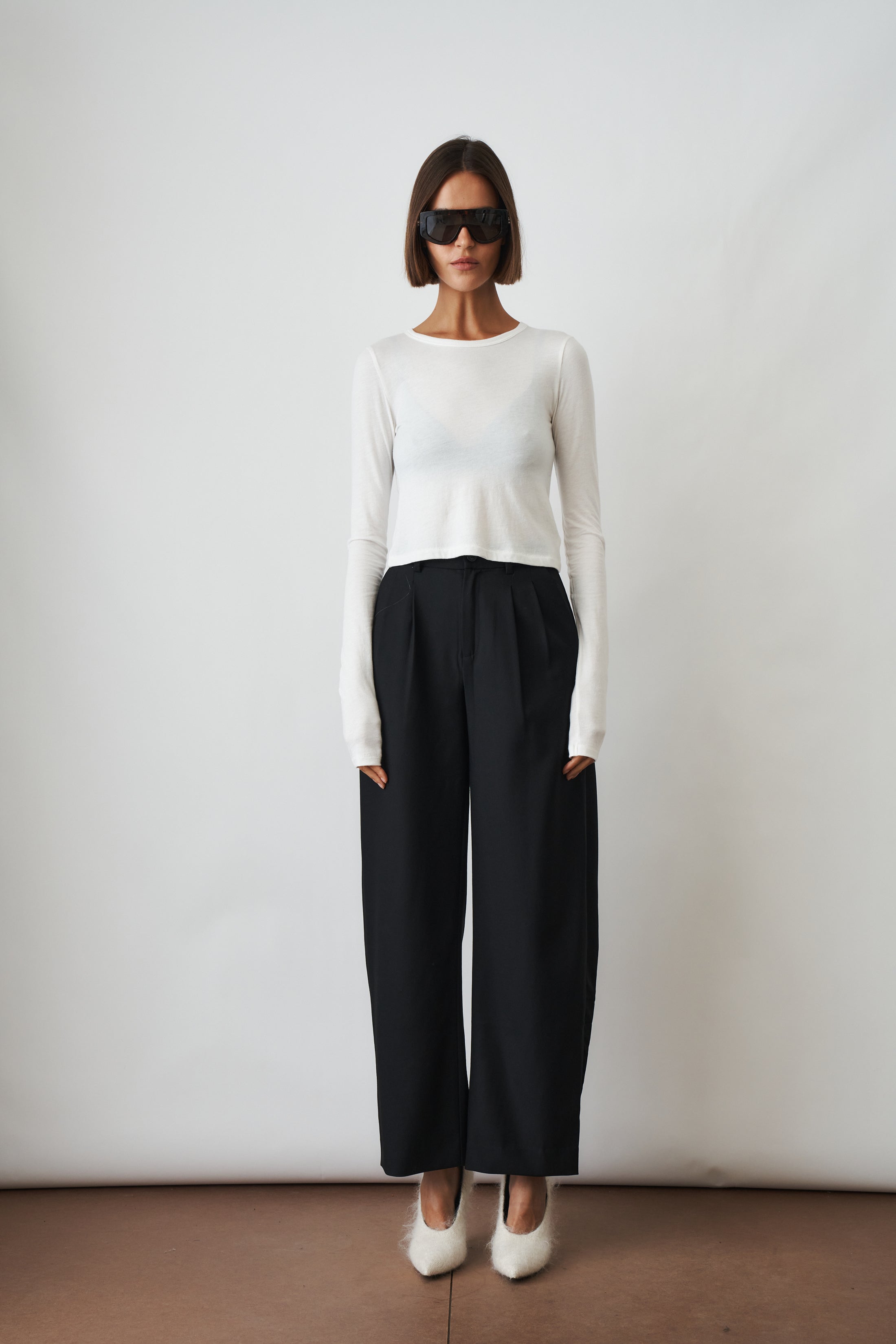 Ivory long sleeve baby tee from ETERNE, soft cotton top for infants with a simple, comfortable design.