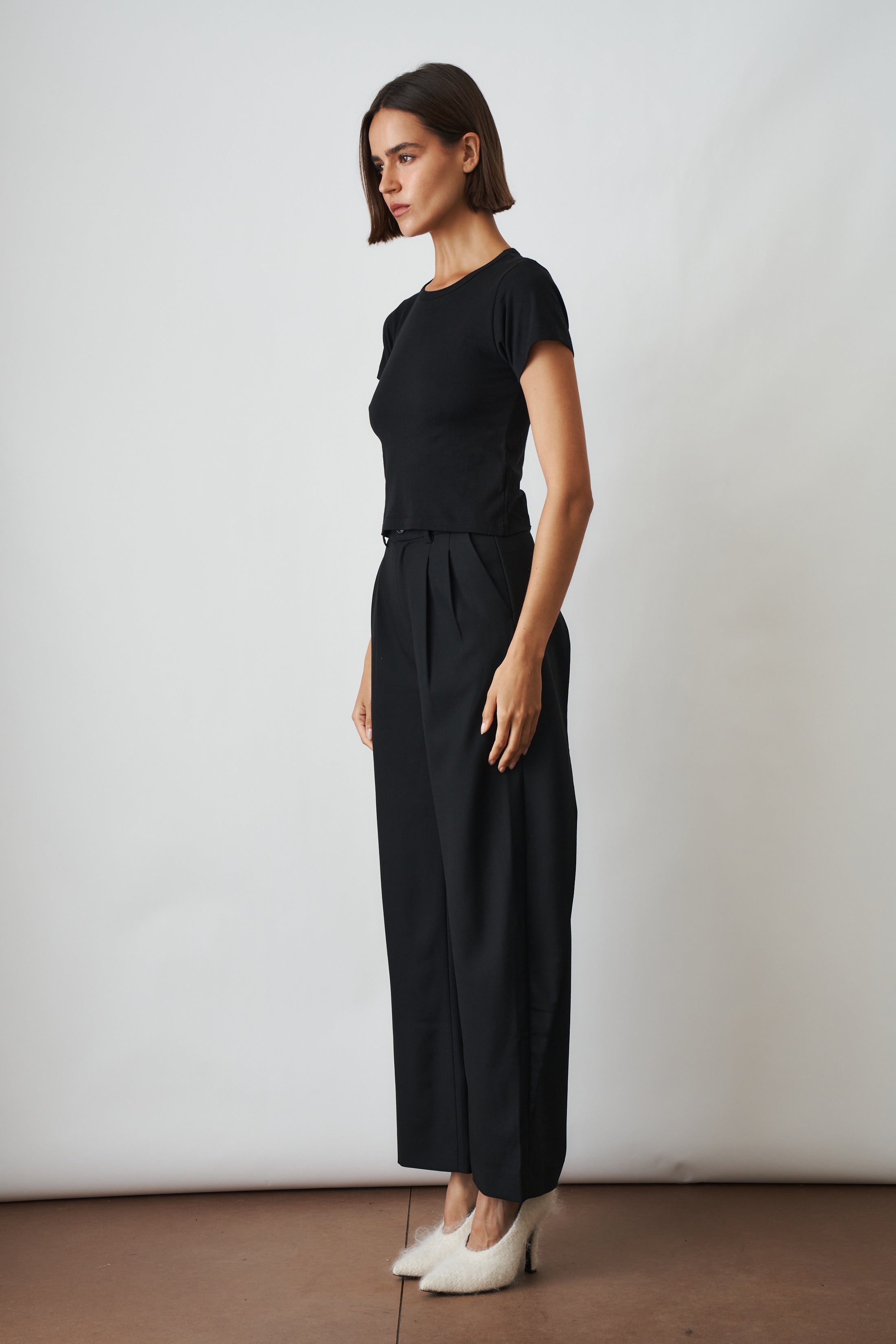 Black short sleeve baby tee from ETERNE, casual toddler top with a simple, comfortable design.