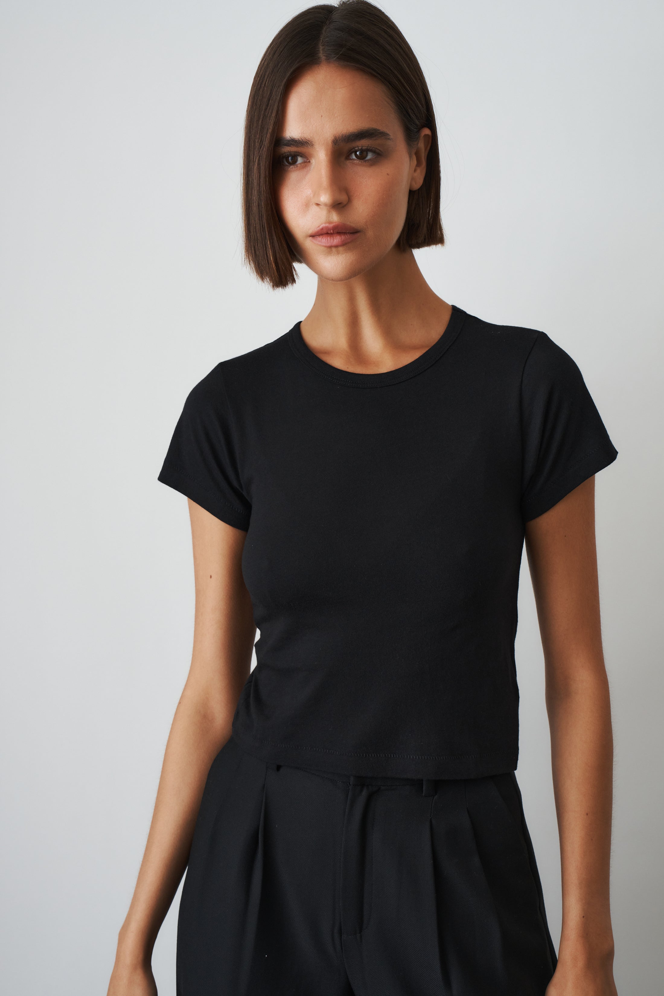 Black short sleeve baby tee from ETERNE, casual toddler tops, soft fabric, simple design with round neckline.