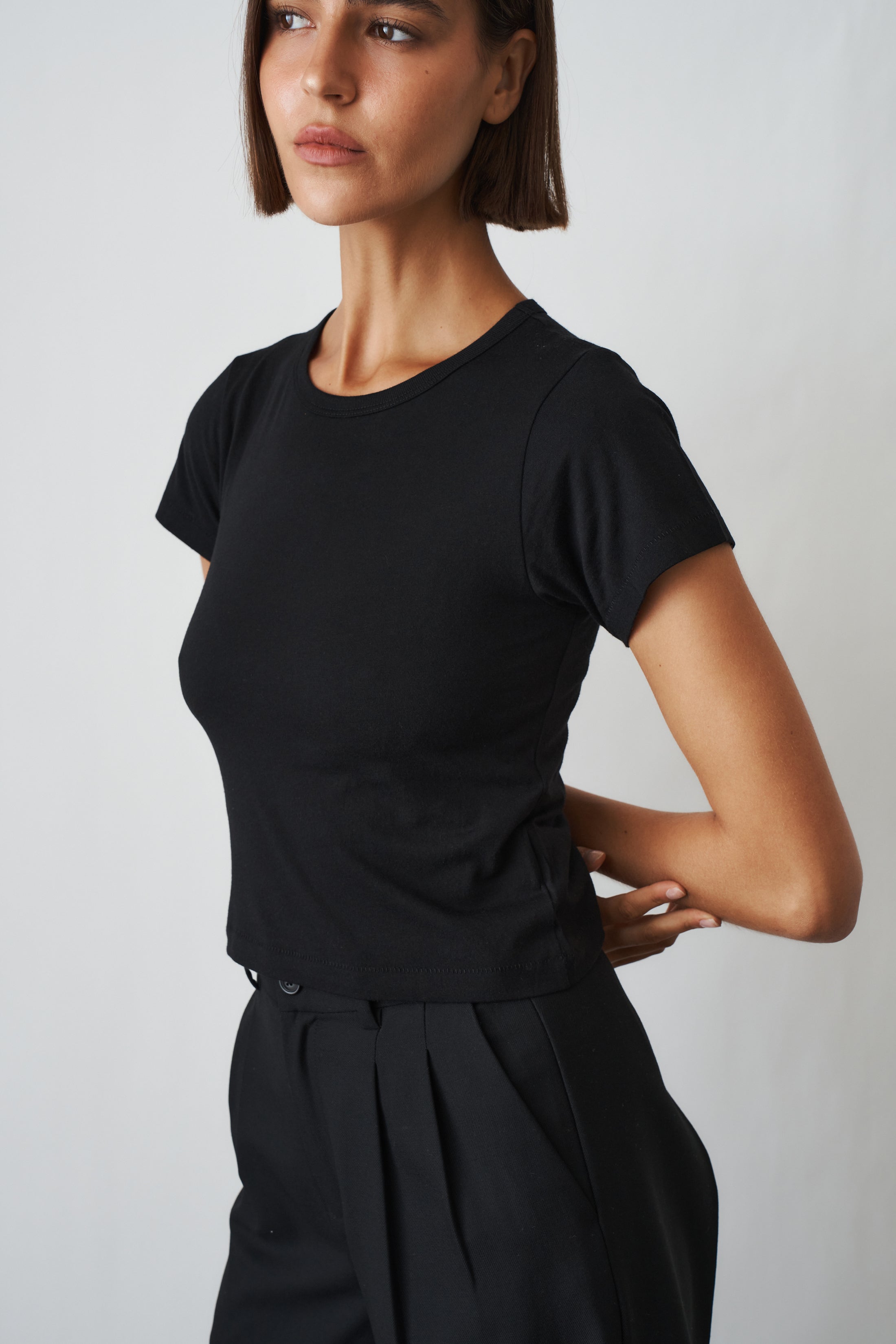 Black short sleeve baby tee by ETERNE, casual toddler top with soft fabric and simple design, perfect for everyday wear.