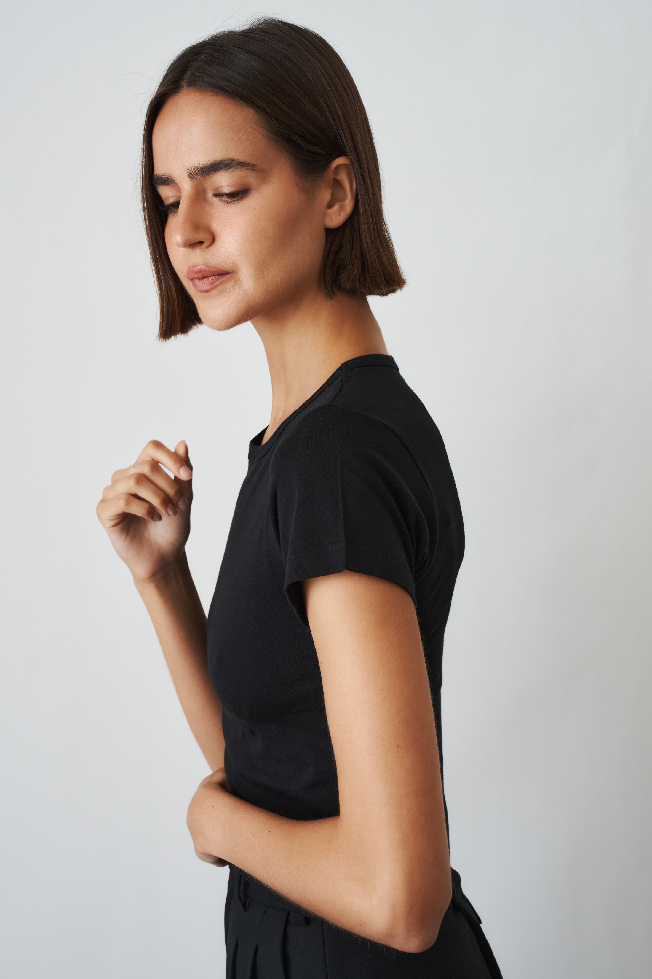 Black short sleeve baby tee from ETERNE, casual toddler top with a soft fabric and simple design.