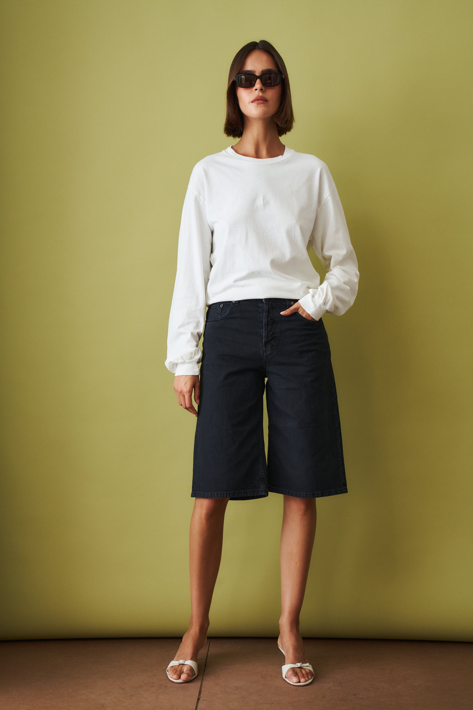 Off-white Ellys T-shirt by Haikure featuring a casual fit, short sleeves, and a classic crew neckline, displayed on a plain background.