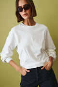Off-white Ellys T-shirt by Haikure, casual tops with a relaxed fit, shown on a plain background.