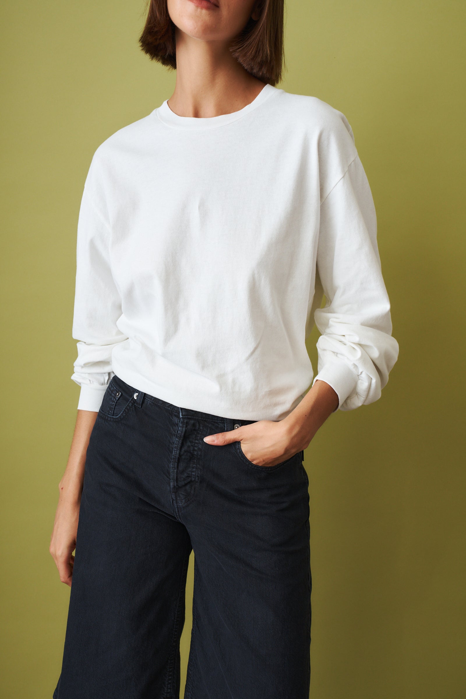 Off-white Ellys T-shirt by Haikure, casual top with a relaxed fit, displayed on a neutral background.