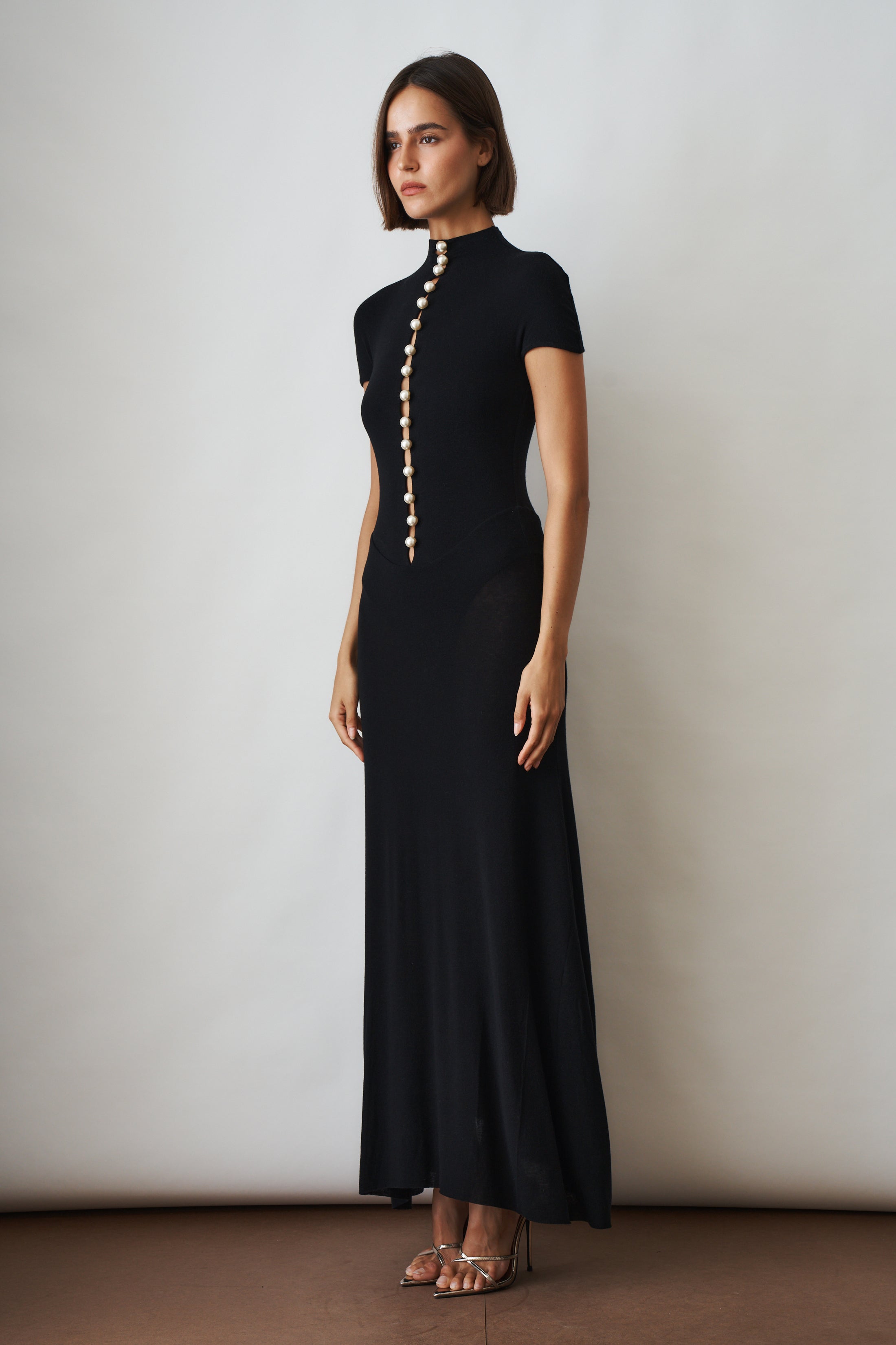 Black Mia Dress by MANURI, stylish and elegant women's dress with a fitted silhouette, shown in XS size.