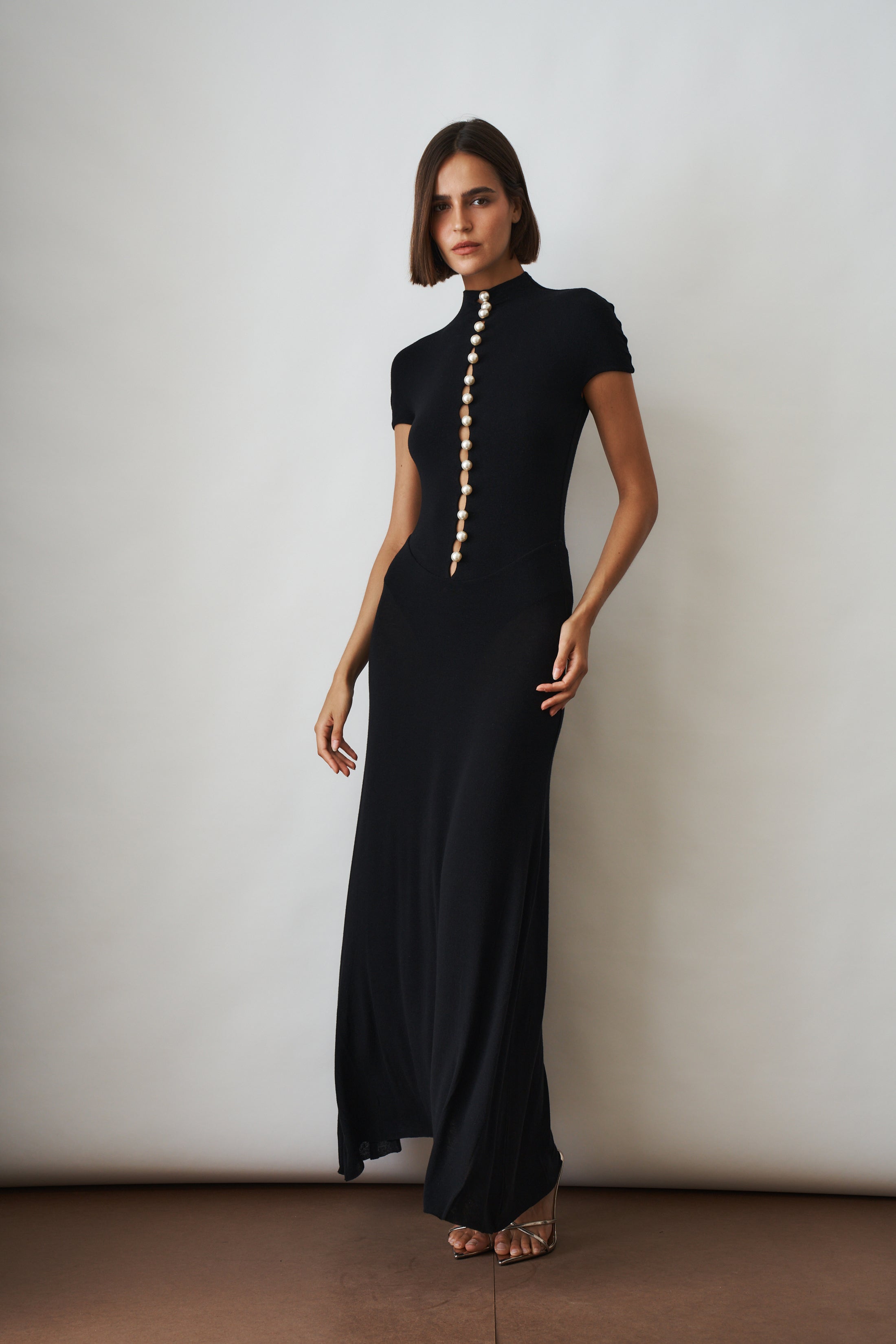 Black Mia Dress by MANURI, casual sleeveless dress with a fitted silhouette and simple design.