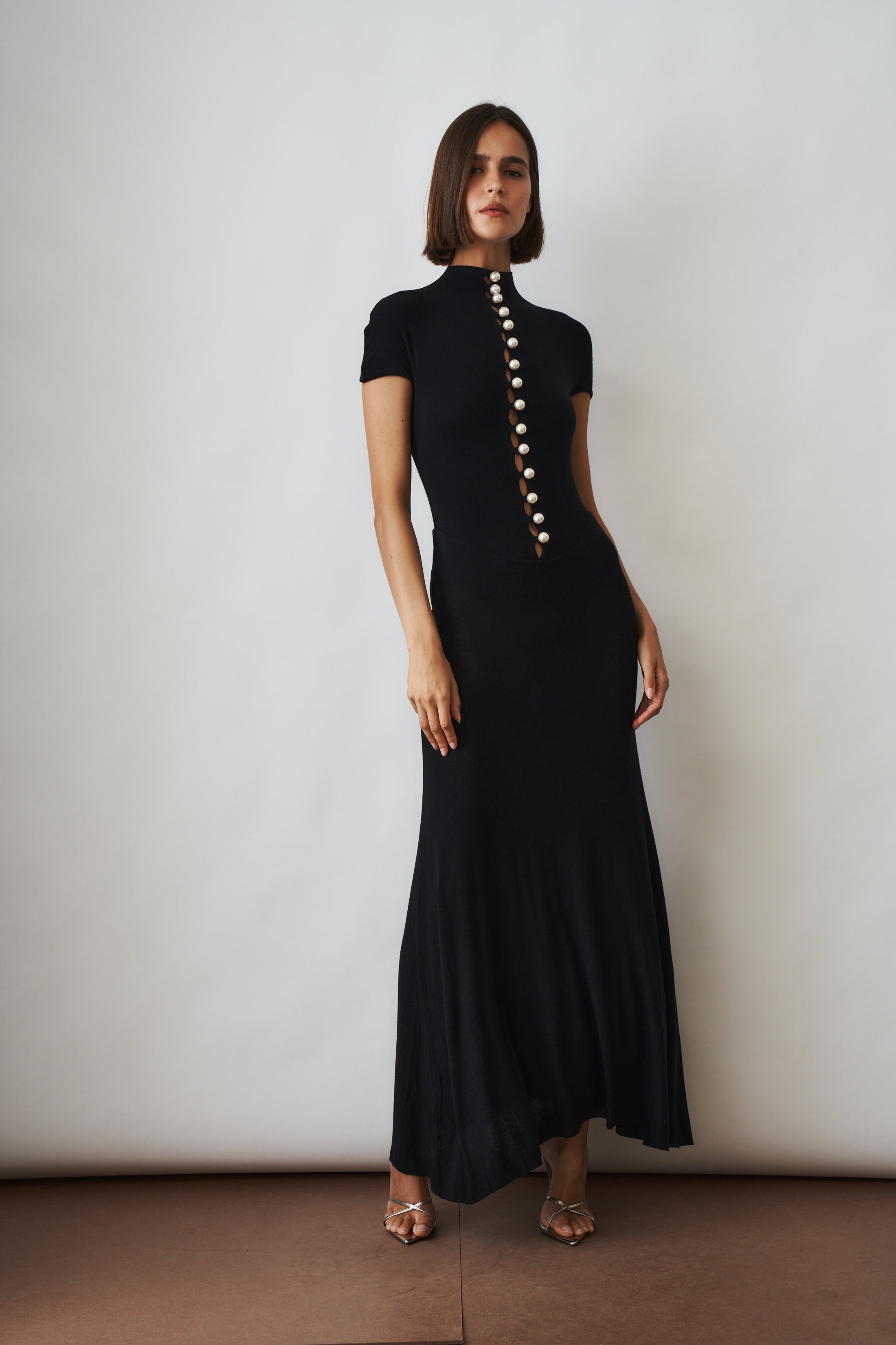 Black Mia Dress by MANURI, shown in size XS, featuring a stylish, elegant design perfect for various occasions.