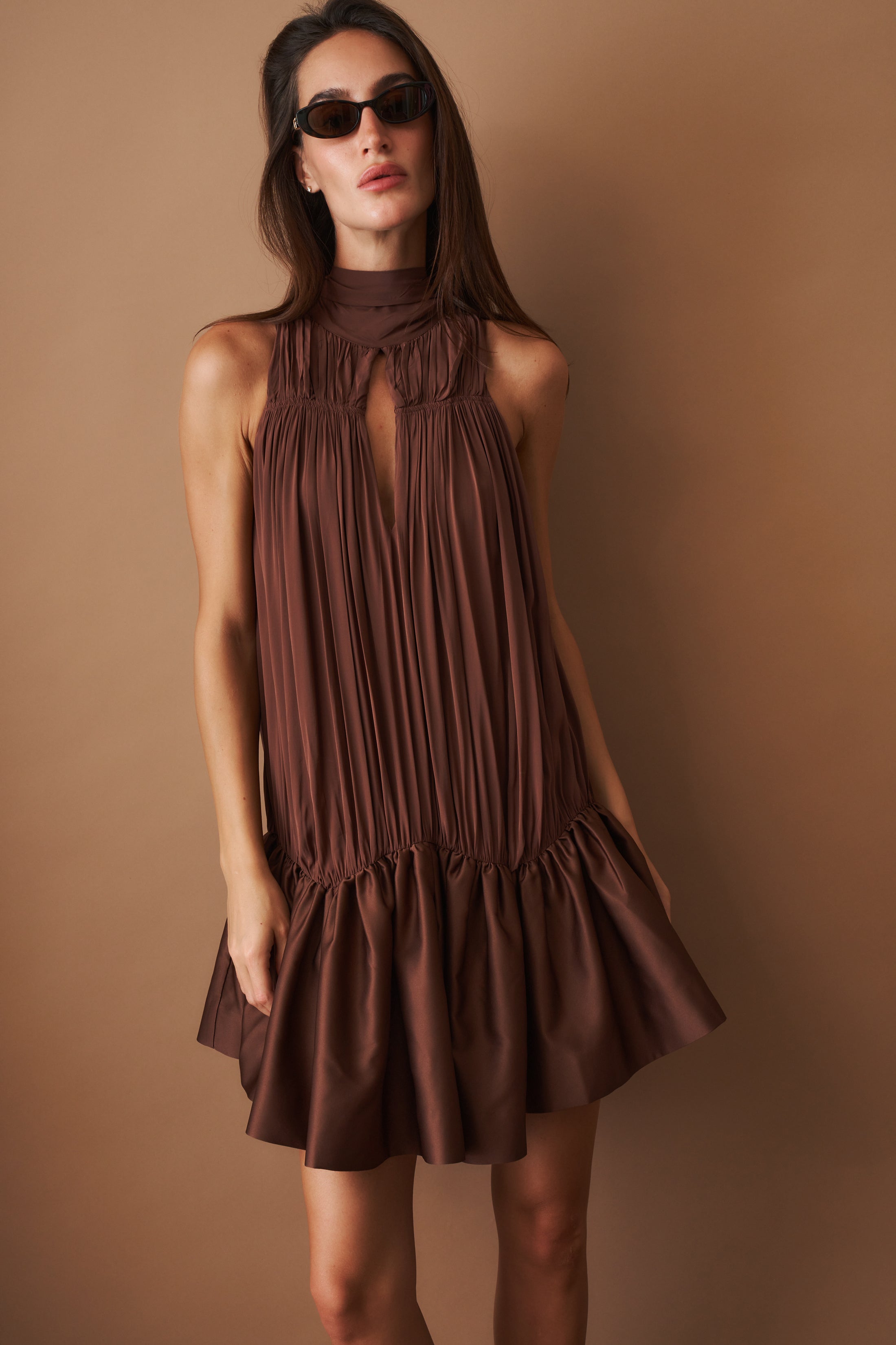 Rotate Gathered Mini Dress, stylish sleeveless dress with a fitted silhouette and gathered fabric details, perfect for summer wear.