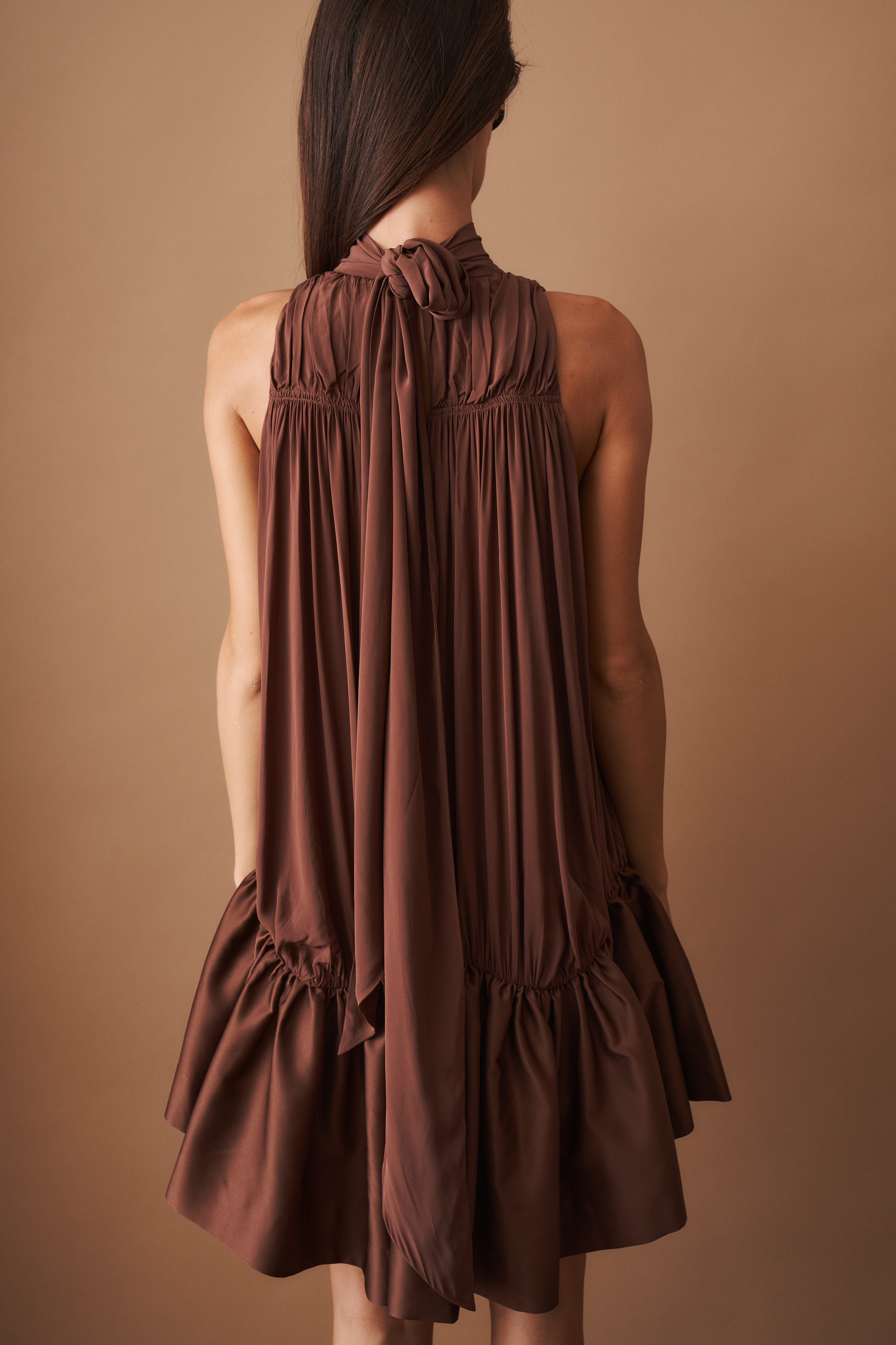 Rotate Gathered Mini Dress, stylish sleeveless dress with ruched details, perfect for casual or evening wear.