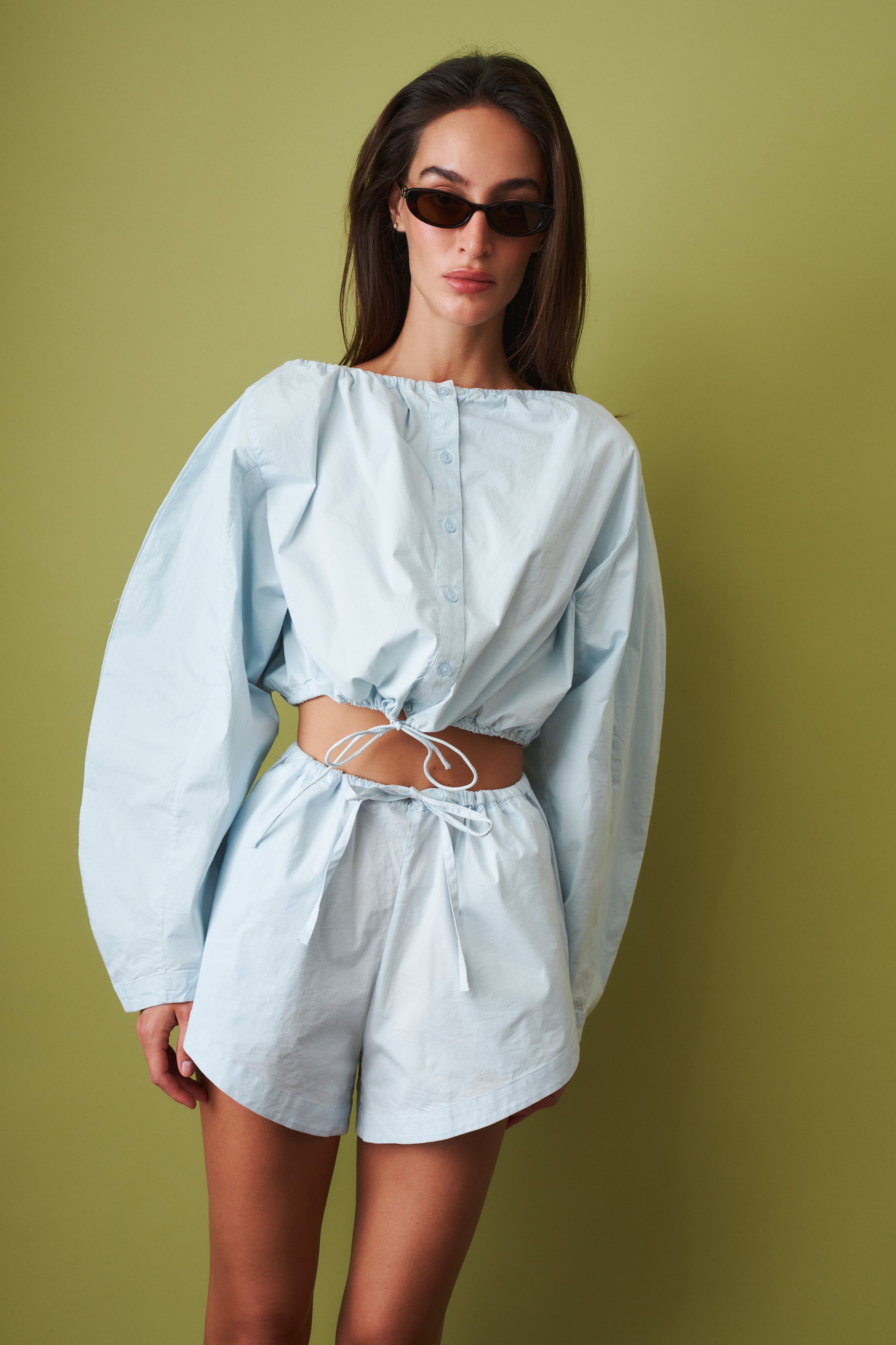 ROTATE drawstring shorts featuring a casual fit, with a lightweight fabric and adjustable waistband, shown on a model.