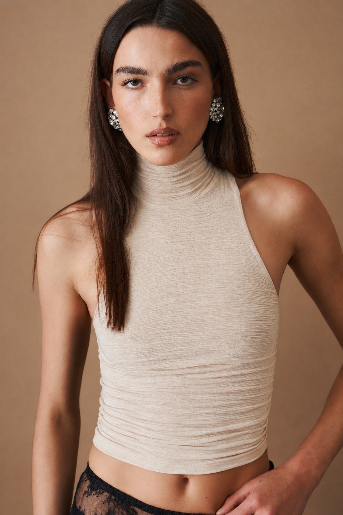 The Rachel Plissé in cream, halter funnel neck cropped top